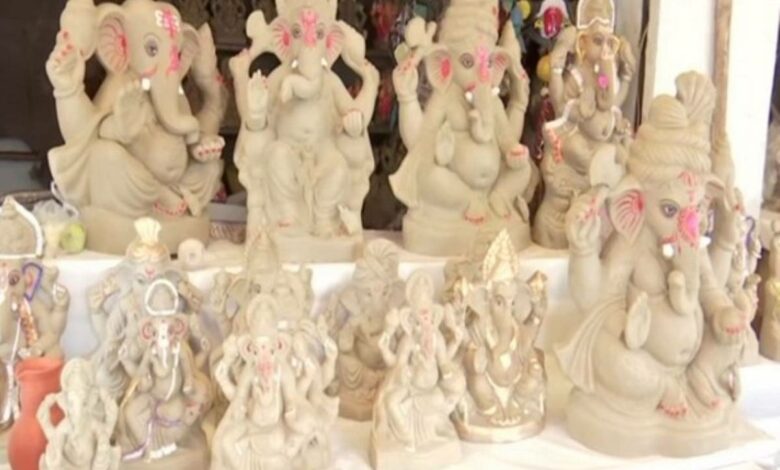 Telangana chief secretary unveils posters of clay Ganesh idols
