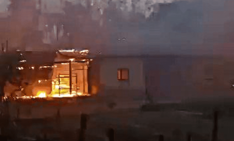 A house burns during the ethnic violence that hit Manipur two years ago