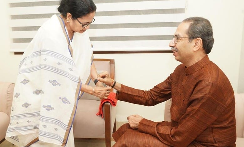 Mamata Banerjee ties rakhi to Uddhav Thackeray