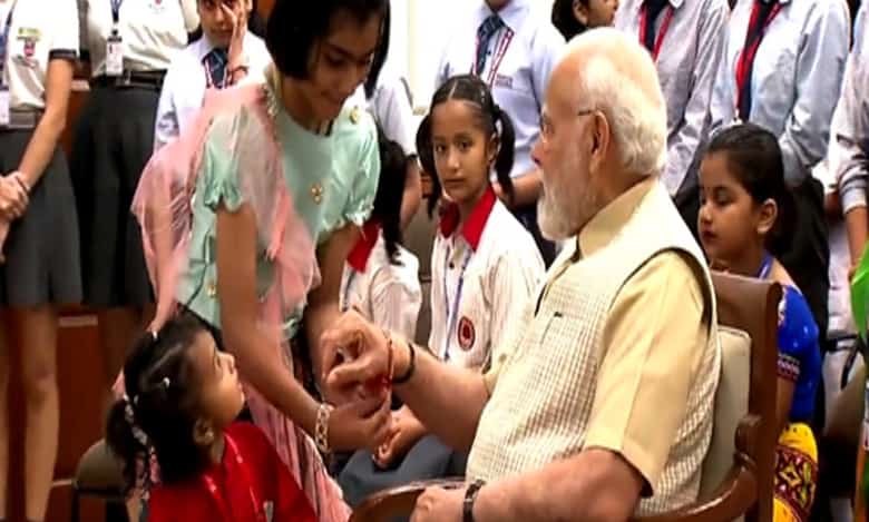 PM celebrates Raksha Bandhan with school girls