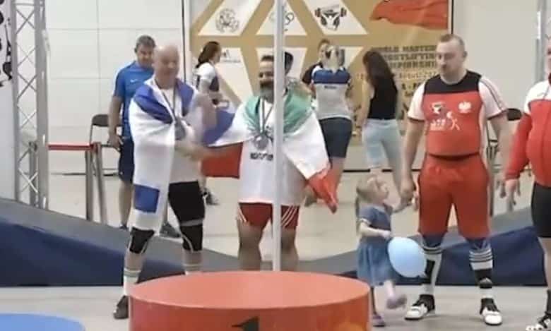Iran bans weightlifter for life over handshake with Israeli athlete