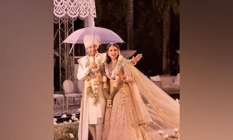 Parineeti, Raghav groove under umbrella as they walk down aisle