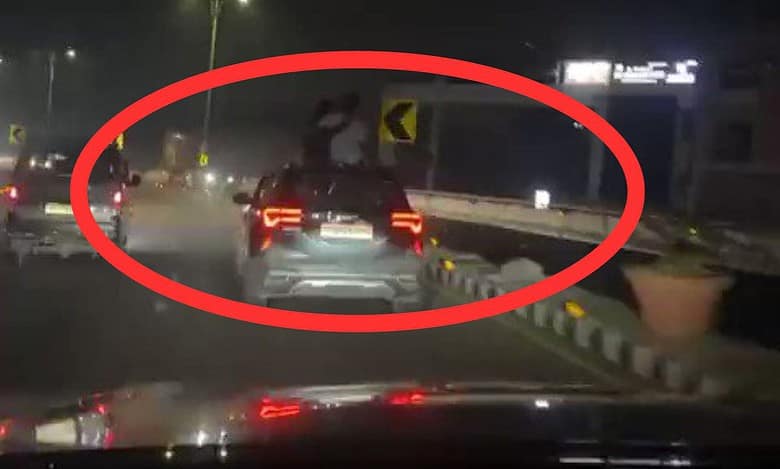 couple kissing on car in Hyderabad