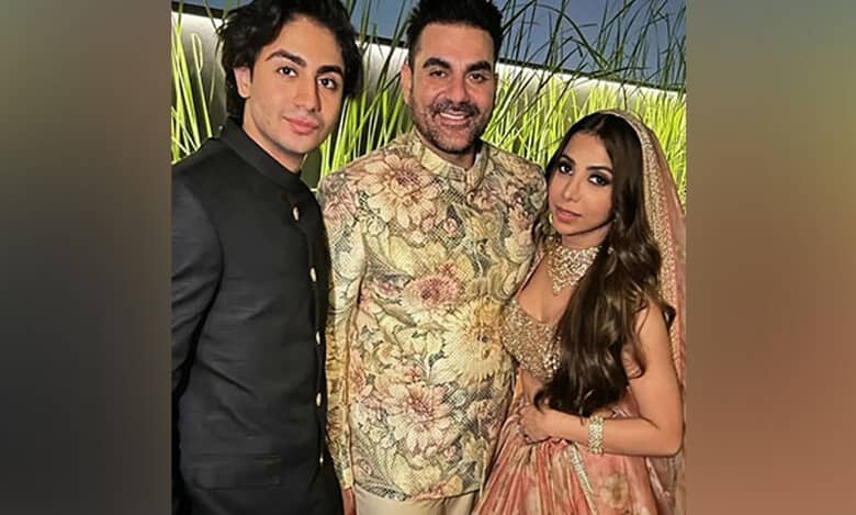 Newlyweds Arbaaz, Shura pose with son Arhaan at wedding ceremony