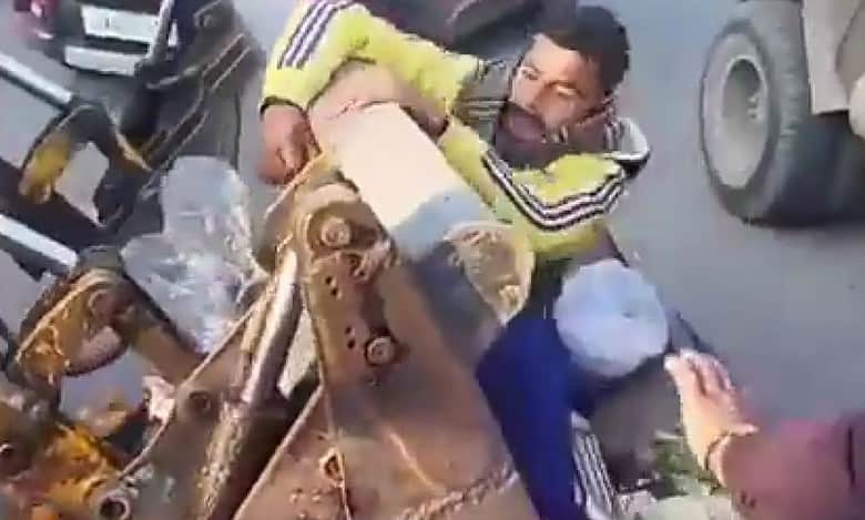 Video: Vegetable vendor hangs on JCB to save cart in Jammu