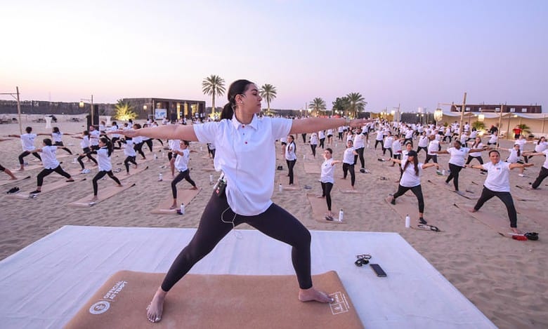 Emirates employees set yoga world record in Dubai desert