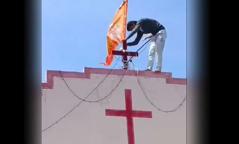 MP: Hindutva men plant saffron flgas atop church, chant Jai Shri Ram