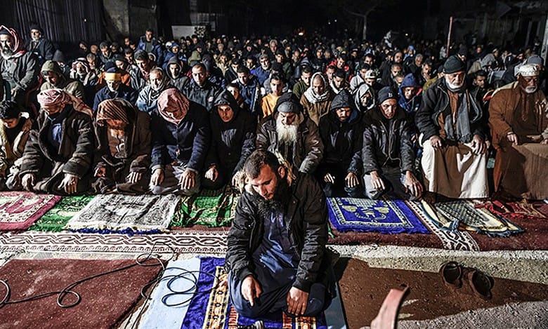 Palestinians perform Taraweeh prayers at destroyed Al-Farouq Mosque in Gaza
