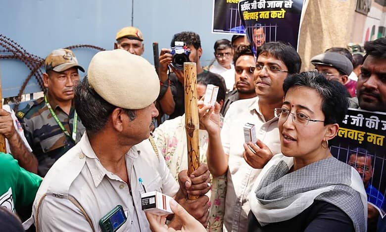 Atishi, AAP workers carrying insulin gather outside Tihar Jail