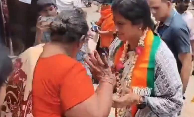 Woman pushes BJP Hyderabad MP candidate during campaigning