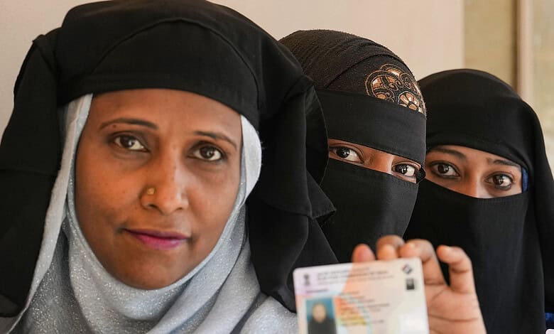 Burqa clad woman at a polling station