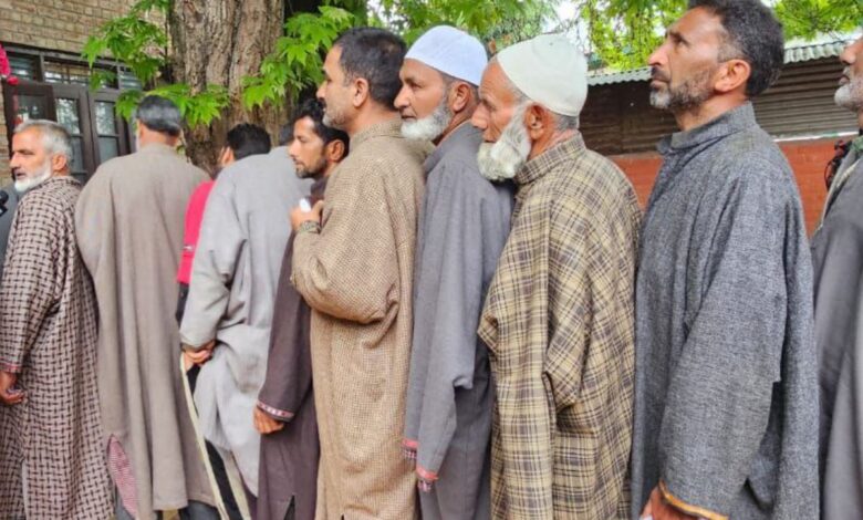 Voters line up outside polling stations in J&K's Srinagar LS seat