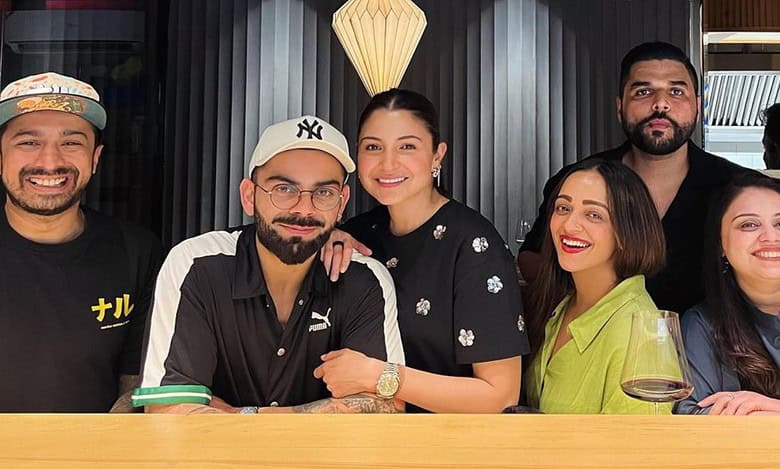 Anushka, Virat twin in black as they step out for date, poses with fans