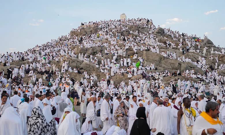 Muslim pilgrims gather at the top of the rocky hill known as the Mountain of Mercy, on the Plain of Arafat, during the annual Haj pilgrimage, near the holy city of Makkah In 2024.