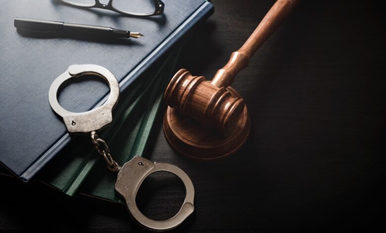 Representational image of handcuffs leading to arrest for dumping son’s body after electrocution in Adilabad