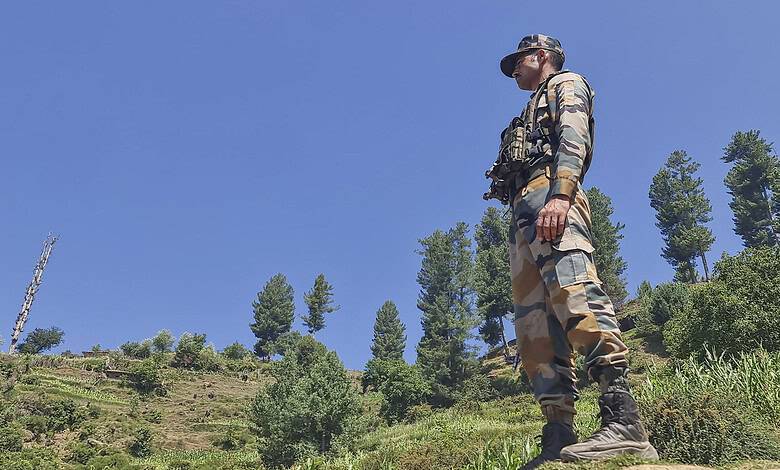 Doda: A security personnel stands guard during an anti-terror operation after four Army personnel, including an officer, died after being injured in a gunfight with terrorists, in Doda district of Jammu and Kashmir, Tuesday, July 16, 2024. (PTI Photo)(PTI07_16_2024_000026B)