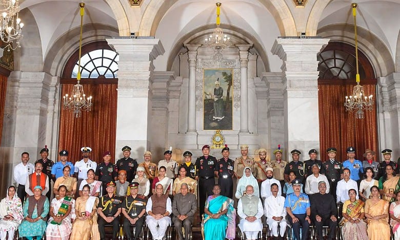 Prez Murmu presents the Gallantry Award to a recipient at the Defence Investiture Ceremony-2024