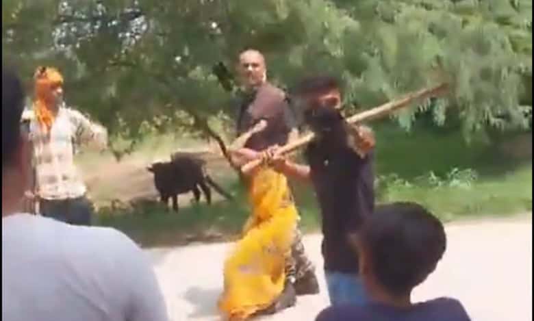 A woman being forcibly taken away at gunpoint by her in-laws in UP