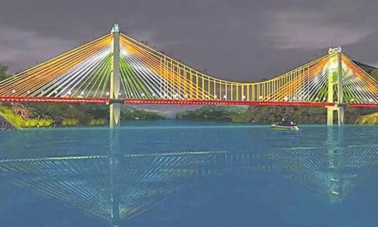 Union minister Nitin Gadkari says that the tender process for construction of iconic double-decker cable-stayed bridge between AP and Telangana will be called for in September.