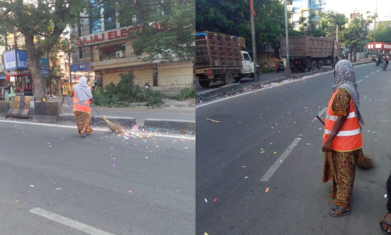 GHMC sweepers face the difficult task of clearing coloured paper strips from the city roads on Wednesday morning.