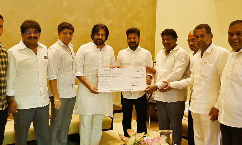 Pawan Kalyan hands over Rs 1 cr cheque to Telangana CM Revanth flood relief