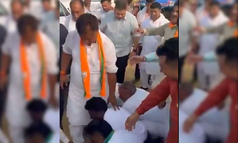 Video: Haryana BJP leader walks on cadre’s hands to ‘bless’ them