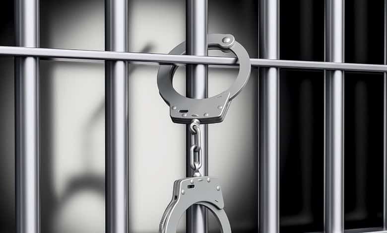 A representational image of handcuffs depicting arrest