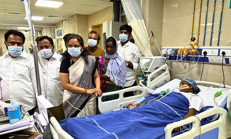 MLC Kavitha visiting a victim of school food poisoning at Hyderabad NIMS