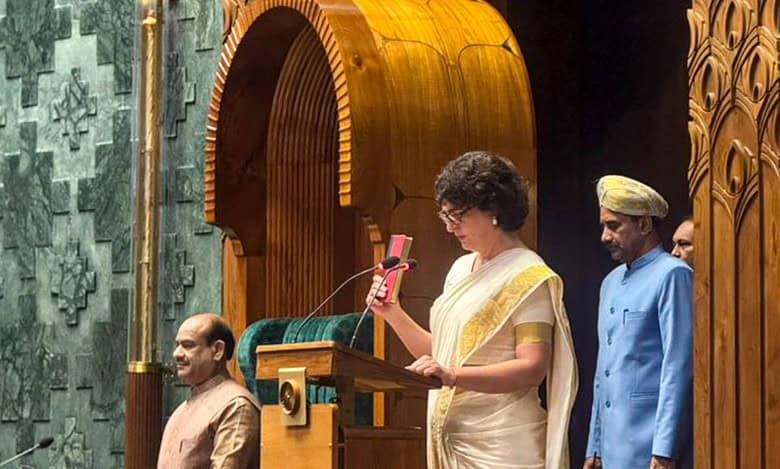 Congress leader Priyanka Gandhi Vadra takes oath as a Member of Parliament in the Lok Sabha during the Winter session of Parliament, in New Delhi