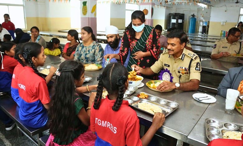CV Anand having lunch with the students at Musheerabad minority welfare girls residential school