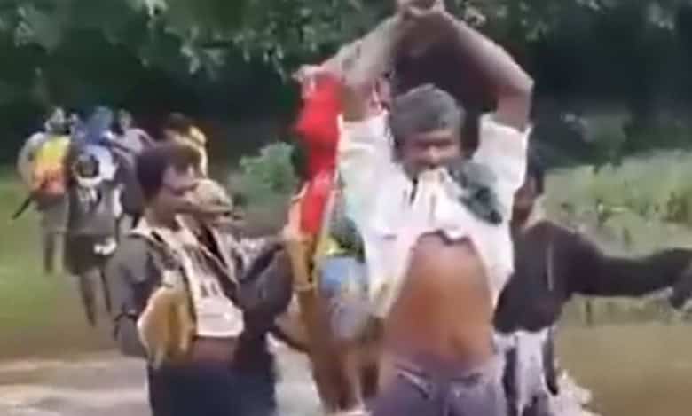 Tribals in AP carry pregnant woman in 'doli' across stream to hospital