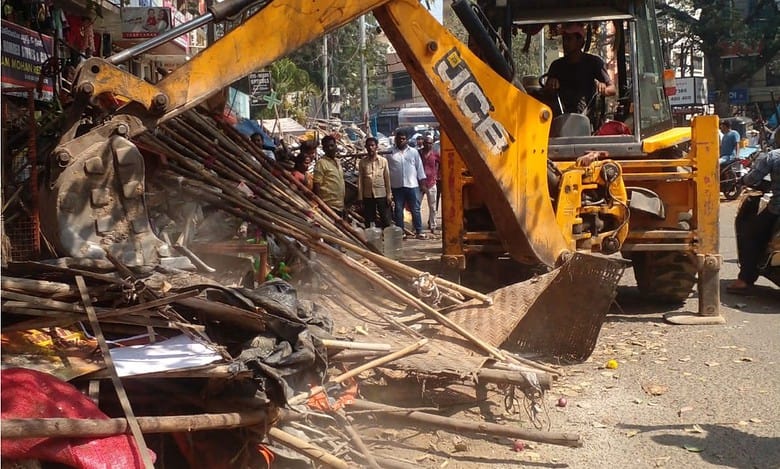 GHMC's enforcement wing demolishes vegetable, fruit and flower shops in le market on Friday, January 31.