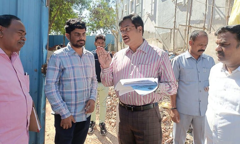 HYDRAA commissioner AV Ranganath inspects illegal construction in Ayyappa Society of Khanamet village in Serilingampally mandal on Saturday.