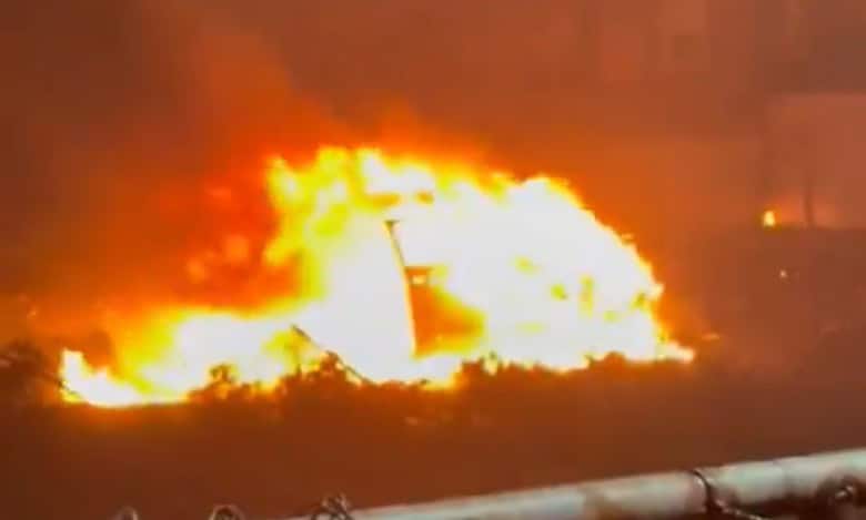 Car on fire after plane crash in Philadelphia us