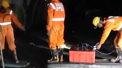 Rescue agencies explain the progress of their efforts inside the SLBC tunnel at a review meeting.
