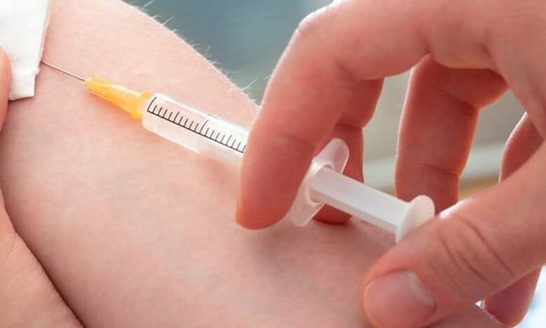 Vaccine injection being administered into arm, healthcare, immunization, medicine, vaccination, health care, immunization drive, healthcare worker, medical procedure, vaccination shot.