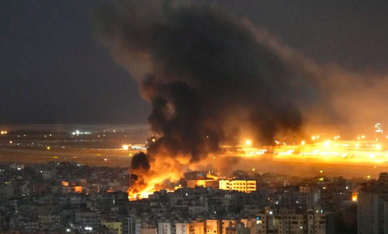 Representative image showing massive fire and thick smoke rising over buildings during a night-time airstrike.