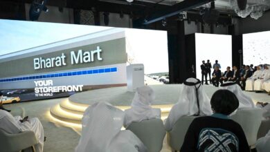 Delegates attend the launch event of Bharat Mart in Dubai, with a large screen displaying the marketplace's name and slogan.