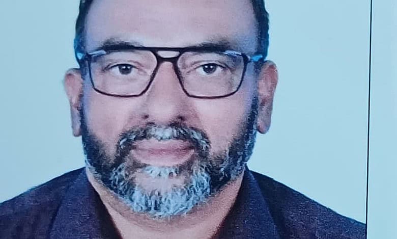Photo of Samsudhin Hosdurg, Indian expat and Big Ticket Abu Dhabi winner, wearing glasses and a dark shirt.
