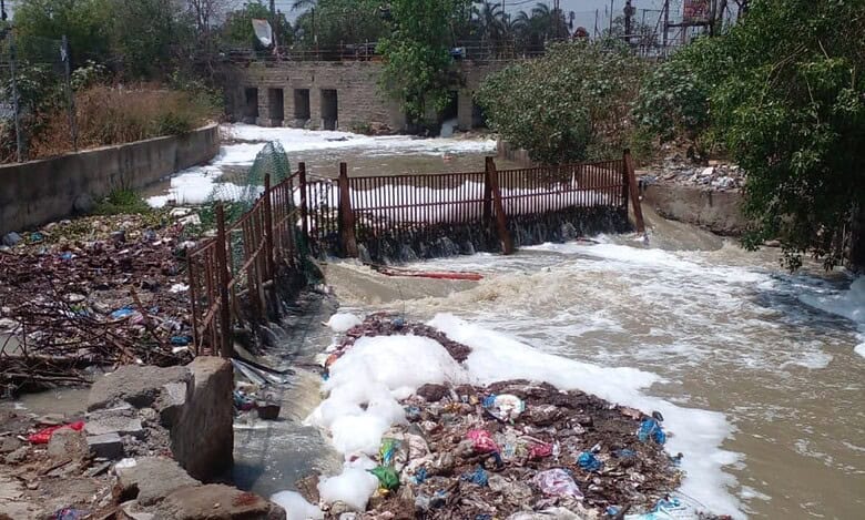 Chemical and industrial waste enters Saroornagar lake during rains on Thursday.