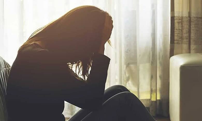 Upset teenage girl sitting alone, representing Hyderabad girl who ran away after parental scolding.