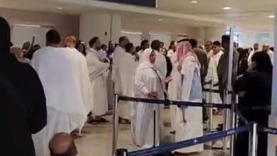 Dozens of Egyptian pilgrims in ihram attire stand and protest inside King Abdulaziz International Airport in Jeddah after being detained for attempting to perform Umrah without valid Haj permits