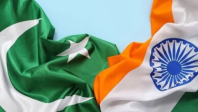 The image displays a picture of Indian and Pakistani flags