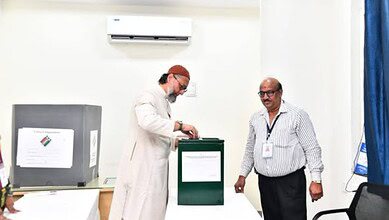 The image shows AIMIM chief Asaduddin Owaisi casting his vote for the Hyderabad local authorities MLC election held on Wednesday, April 23, 2025.