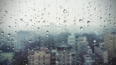 Representational image of a rain soaked window in Hyderabad with water droplets.