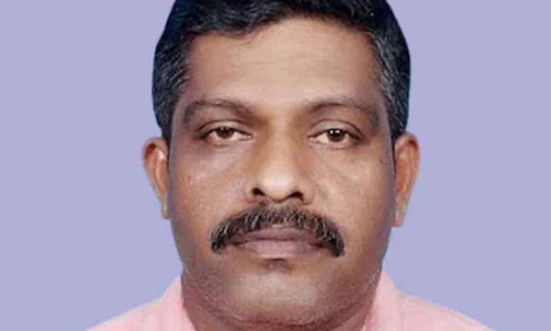 An Indian technician, who won the Big Ticket jackpot, wearing a pink shirt against a plain background.