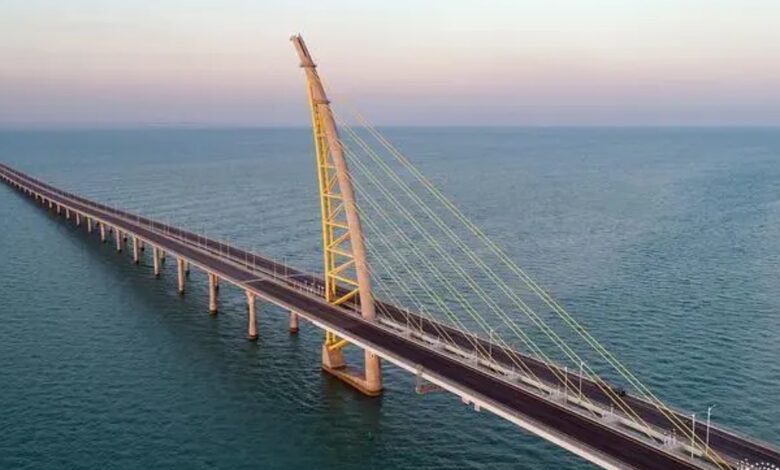 Aerial view of Jaber Bridge in Kuwait, an architectural marvel spanning the sea with a striking cable-stayed design.