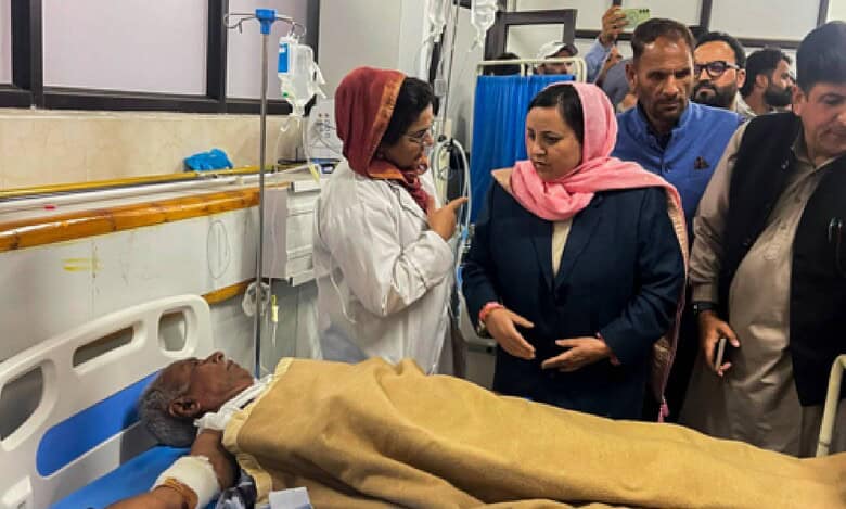 Jammu and Kashmir Minister Sakina Itoo speaks with medical staff while visiting an injured victim of the Pahalgam terror attack receiving treatment at a hospital in Anantnag district.