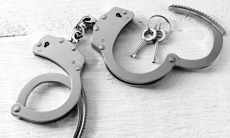 Representational Image of handcuffs on the desk