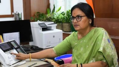 Santhi Kumari on a conference call in her office
